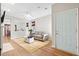 Comfortable living room with a neutral color palette and a view to the dining room at 104 Chemistry Cir, Ladson, SC 29456