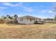 Expansive backyard featuring a wooden deck and privacy fence, perfect for outdoor gatherings at 105 Gourdin St, Saint Stephen, SC 29479