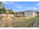 Spacious backyard with a wooden deck and full perimeter fence at 105 Gourdin St, Saint Stephen, SC 29479