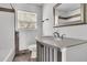 Bathroom featuring a unique vanity, neutral tones and decorative mirror at 105 Gourdin St, Saint Stephen, SC 29479
