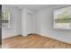 Bright bedroom with hardwood floors, two windows and a closet for storage at 105 Gourdin St, Saint Stephen, SC 29479