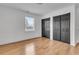 Bedroom with hardwood floors, large closet, and window providing lots of natural light at 105 Gourdin St, Saint Stephen, SC 29479