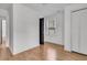 Hardwood bedroom with natural light near black painted door and white closet at 105 Gourdin St, Saint Stephen, SC 29479