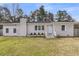 Charming single story home featuring tidy landscaping and updated white brick at 105 Gourdin St, Saint Stephen, SC 29479