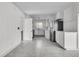 Bright, fully-equipped white kitchen with stainless steel appliances and subway tile backsplash at 105 Gourdin St, Saint Stephen, SC 29479