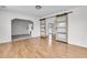 Bright living room featuring modern sliding barn doors and wood floors offers an open concept feel at 105 Gourdin St, Saint Stephen, SC 29479