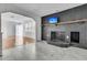 Cozy living room featuring a painted brick fireplace, mantle, and television above at 105 Gourdin St, Saint Stephen, SC 29479