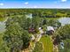 A gorgeous aerial view of lush tree-lined lot and home with lake access at 107 Cotton Blossom Way, Summerville, SC 29485
