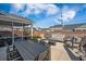 Expansive backyard patio with outdoor seating, dining, and entertainment areas at 107 Cotton Blossom Way, Summerville, SC 29485