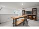 Bright basement features carpet floors, a small bar table with furniture, and a shelf with books at 107 Cotton Blossom Way, Summerville, SC 29485