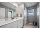 Bathroom with double vanity, modern finishes, and ample natural light at 107 Cotton Blossom Way, Summerville, SC 29485
