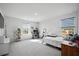Bright bedroom with a modern desk, stylish decor, and large windows at 107 Cotton Blossom Way, Summerville, SC 29485