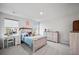 Bedroom with a cozy bed, study desk, and dresser in a naturally lit space at 107 Cotton Blossom Way, Summerville, SC 29485
