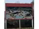Sign showing the community pool area rendering with pools, seating and sunshades at Summers Corner at 107 Cotton Blossom Way, Summerville, SC 29485