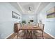 Elegant dining room featuring a tray ceiling, modern lighting, and formal dining set for gatherings at 107 Cotton Blossom Way, Summerville, SC 29485