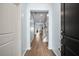 Welcoming foyer featuring hardwood floors, soft blue walls, and views of the staircase at 107 Cotton Blossom Way, Summerville, SC 29485