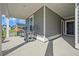 Inviting covered front porch with seating, offering a relaxing outdoor space with lovely views at 107 Cotton Blossom Way, Summerville, SC 29485