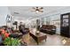 Comfortable living room with leather sofas, wood coffee table, and natural light at 107 Cotton Blossom Way, Summerville, SC 29485