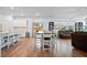 Open-concept living space with dining table, kitchen island, and cozy seating area at 107 Cotton Blossom Way, Summerville, SC 29485