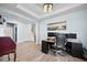 Bright home office with modern furnishings, including a desk, chair, and ample workspace at 107 Cotton Blossom Way, Summerville, SC 29485