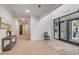 Bright lobby featuring neutral tones, modern decor, and direct access to the building's exterior at 108 Fairbanks Oak Aly # 302, Daniel Island, SC 29492