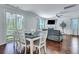 Bright dining area with hardwood floors and sliding glass doors to the outdoor space at 109 Loon Dr, Summerville, SC 29483