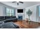 Comfortable living room with a fireplace, hardwood floors, and lots of natural light at 109 Loon Dr, Summerville, SC 29483