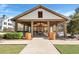 Covered pavilion with picnic tables, a brick fireplace and lush landscaping at 109 Loon Dr, Summerville, SC 29483