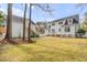 Beautiful backyard showcasing lush greenery and a detached structure at 124 Beresford Creek St, Charleston, SC 29492
