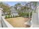 Spacious backyard with a well-manicured lawn and detached garage at 124 Beresford Creek St, Charleston, SC 29492