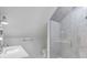 This bathroom features a white vanity and a glass-enclosed shower with stylish gray tiling at 124 Beresford Creek St, Charleston, SC 29492
