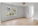 Bright bedroom with large windows, hardwood floors, white trim, and a basket-weave light fixture at 124 Beresford Creek St, Charleston, SC 29492