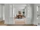 Elegant dining room with hardwood floors, statement lighting, and ample natural light for gatherings at 124 Beresford Creek St, Charleston, SC 29492