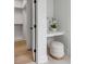 Bright dressing area with a vanity, stool, and a view into the wardrobe at 124 Beresford Creek St, Charleston, SC 29492