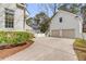 Spacious driveway leading to a two-car garage and charming backyard at 124 Beresford Creek St, Charleston, SC 29492