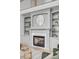 Elegant fireplace with marble surround, custom built-ins, and decorative accents for a cozy atmosphere at 124 Beresford Creek St, Charleston, SC 29492