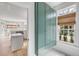 Laundry room offers storage, washer and dryer hookups, and window with natural woven shade at 124 Beresford Creek St, Charleston, SC 29492
