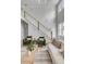 Bright living room with a staircase, large windows, and stylish seating arrangements, perfect for relaxation at 124 Beresford Creek St, Charleston, SC 29492