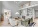 Open-concept living room with a fireplace, comfortable seating, and view to a sunlit dining area at 124 Beresford Creek St, Charleston, SC 29492