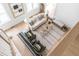 Open-concept living room with hardwood floors, stylish furnishings, and abundant natural light at 124 Beresford Creek St, Charleston, SC 29492