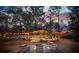 Cozy backyard retreat with a fire pit, string lights, wooden deck and comfortable seating at 1327 Bob White Dr, Charleston, SC 29412
