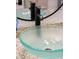 Close up of a designer vessel sink with updated faucet and stone countertop at 1327 Bob White Dr, Charleston, SC 29412