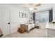 Cozy bedroom with a twin bed, neutral decor, natural light, and charming decorative prints on the wall at 1327 Bob White Dr, Charleston, SC 29412