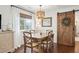 Charming dining room with a wooden table, chairs, and sliding barn door at 1327 Bob White Dr, Charleston, SC 29412