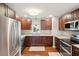 Spacious kitchen with stainless steel appliances, ample counter space, and wood flooring at 1327 Bob White Dr, Charleston, SC 29412