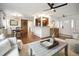 Open living space featuring hardwood floors, comfortable seating, dining area, and kitchen access at 1327 Bob White Dr, Charleston, SC 29412