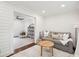 Bright living room with shiplap walls and stylish gray sofa, offering a cozy and modern space at 1327 Bob White Dr, Charleston, SC 29412