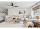 Bright living room featuring a comfortable sectional sofa, accent chairs, and stylish decor at 1327 Bob White Dr, Charleston, SC 29412