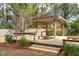 Wooden pergola with a seating area, perfect for relaxation or entertaining in an outdoor space at 1327 Bob White Dr, Charleston, SC 29412