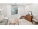 Bright and airy sitting room with shiplap walls, neutral decor, and large windows allowing plenty of natural light at 1327 Bob White Dr, Charleston, SC 29412